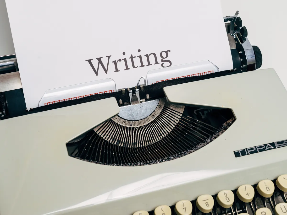 Vintage typewriter with the word "Writing" typed on the page